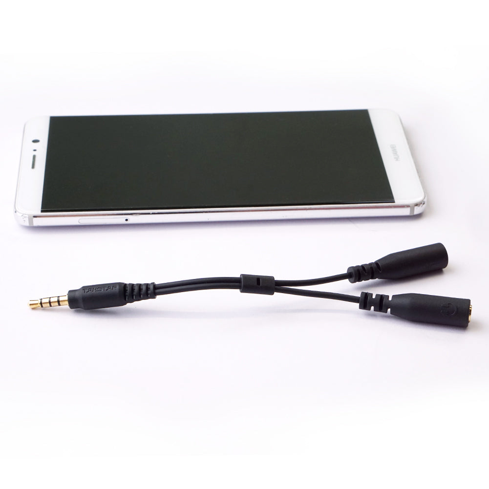 Takstar C2-1 3.5mm stereo audio splitter cable next to a mobile phone
