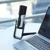 Takstar GX6 Desktop USB Condenser Microphone next to a laptop