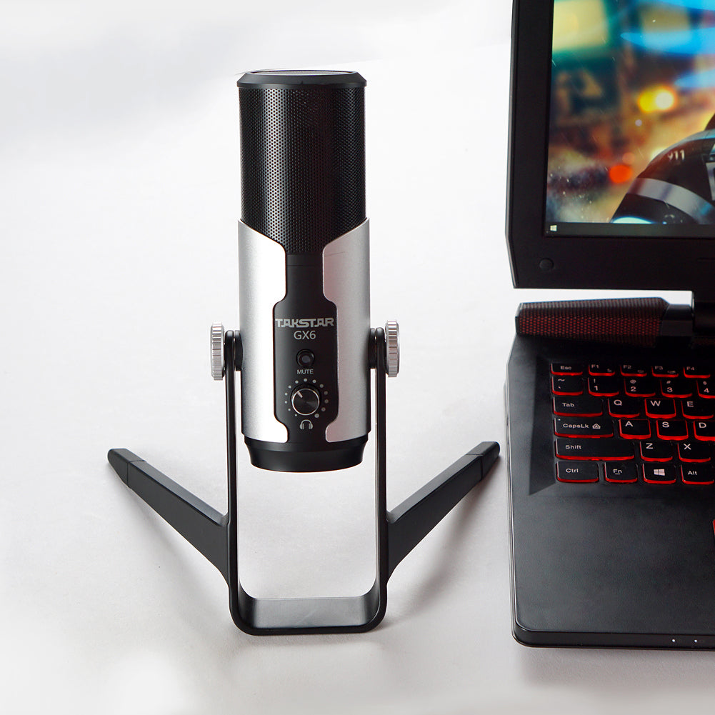 Takstar GX6 Desktop USB Condenser Microphone next to a gaming computer