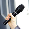Takstar TA-60 Handheld Dynamic Microphone held by a hand