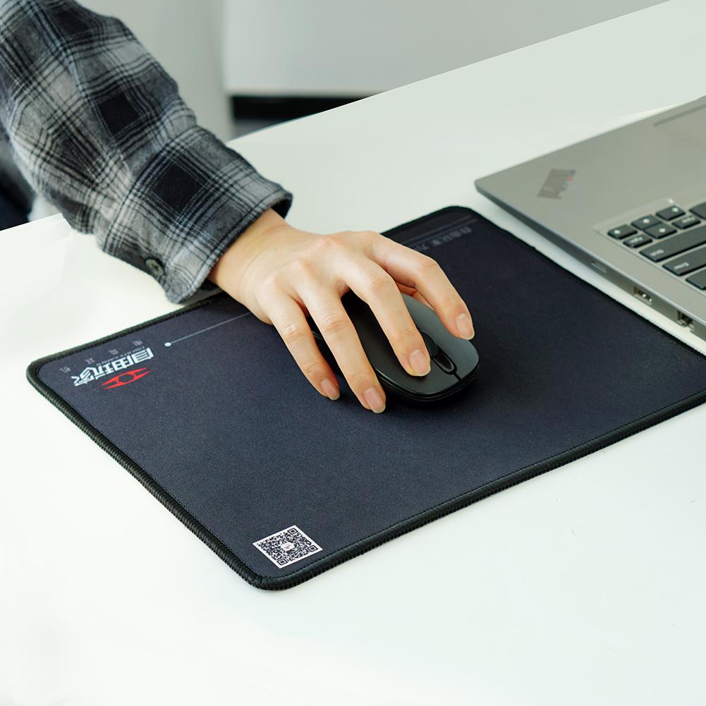 Liberty Gamer Mouse Pad used next to a laptop